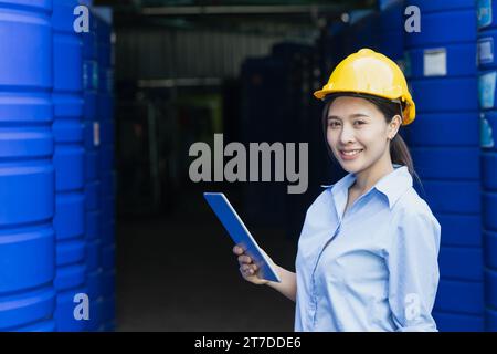 Portrait happy water quality control officer inspector testing water tanks food industry factory for clean and healthy products standards. Stock Photo