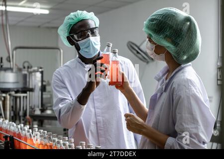 Drink beverage factory QC audit staff quality control worker team working. Hygiene officer clean standard check process inspection in plant production Stock Photo