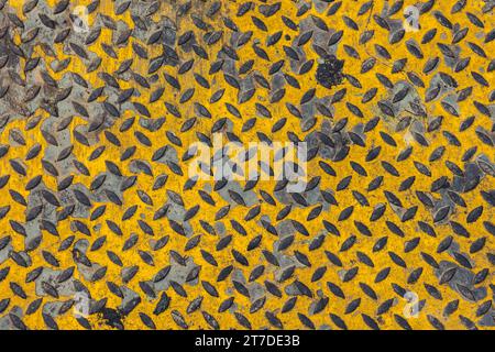 old grunge dirty steel pavement anti slip ground floor yellow color in heavy industry texture pattern for background Stock Photo
