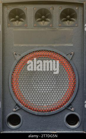 Old used audio speaker texture on dark blue background. Old used audio ...