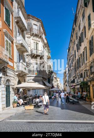 People milling in a shopping street within Corfu Old Town, Corfu., Greece Stock Photo