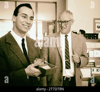 The Manhattan Project. Aga Khan IV received a gift of while visiting the Los Alamos National Laboratory. At right is Dr. Thomas L. Shipman of the Laboratory's Health Division Stock Photo