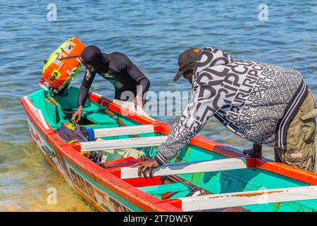 Dakar, Senegal. January 28, 2019: Fishermen with a fishing boat in a beach at Dakar, one of the many fishing beaches of Dakar, Senegal, West Africa Stock Photo