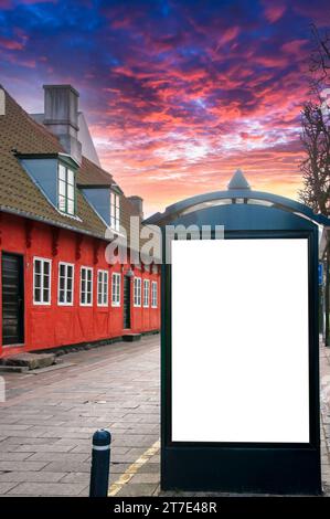 A blank billboard on a city bus shelter for you advertising purposes. Stock Photo