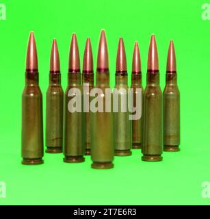 Live ammunition of rifle caliber on a green screen isolated Stock Photo