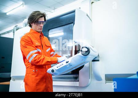 Mechanical engineer using coordinate measuring machine CMM measurement technologies at production line in the industry factory. Stock Photo