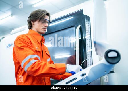 Mechanical engineer using coordinate measuring machine CMM measurement technologies at production line in the industry factory. Stock Photo