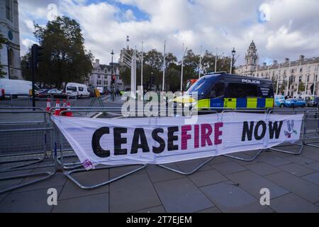 London, UK. 15 November 2023. A  large banner by Extinction Rebellion is diplayed parliament calling for a ceasefire in Gaza.  Members of parliament are to vote in the House of Commons this week on an SNP Scottish Nationalist Party  motion calling for an immediate ceasefire by all parties to the conflict in Israel and Gaza. Credit: amer ghazzal/Alamy Live News Stock Photo
