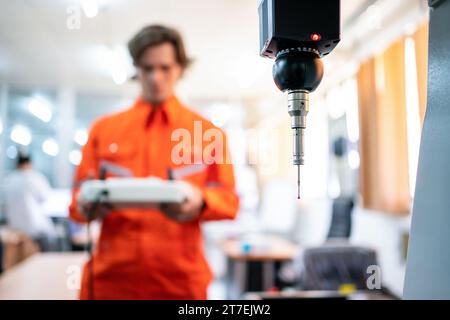 Close-up probe measurement of detail by detecting head sensor at production line in the industry factory. Selective focus Stock Photo