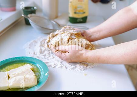 Female hands kneading dough Stock Photo