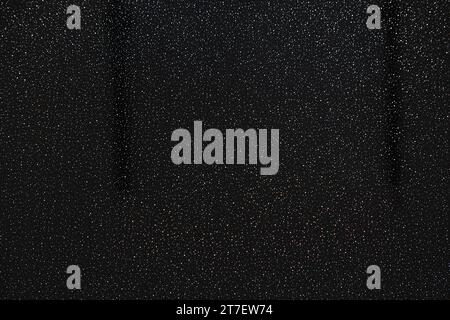 speckled black and multi coloured rainbow effect on a plastic shower panel Stock Photo