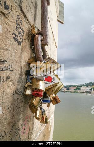 Love symbol padlocks hanged on wall in Florance, Italy Stock Photo