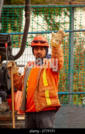 Construction worker waving Stock Photo