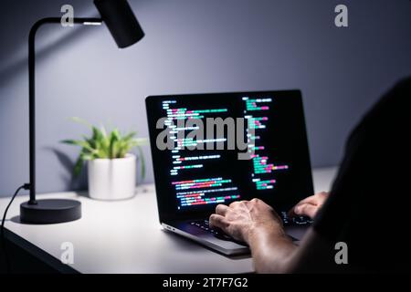 Coder or hacker. Data programmer, developer or engineer in office. Cyber crime security software for fraud and theft online. Stock Photo