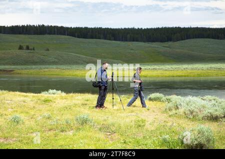 Yellowstone, America–June 14,2016:two photographers working in the wild Stock Photo