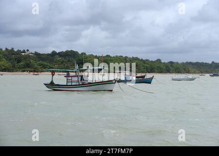 Brazil, Bahia September 7, 2023: fishing boats anchored near the beach ocean Stock Photo