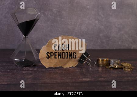 Cash Spending text written on notebook with pen and chart Stock Photo