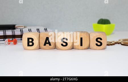 White tile alphabet letter with word basis on wood background Stock Photo