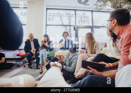 Multicultural Business Team Brainstorming Ideas for Successful Projects in a Positive Office Environment Stock Photo