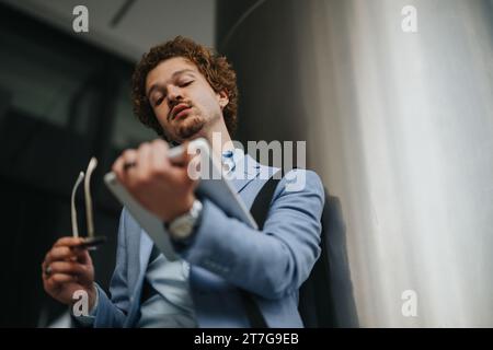 Creative Architects Collaborating on Blueprint for Construction Project Stock Photo