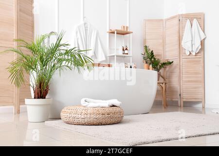 Interior of bathroom with bathtub and accessories Stock Photo
