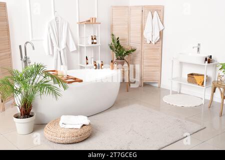 Interior of bathroom with bathtub and accessories Stock Photo