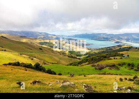 Akaroa is a small town on Banks Peninsula in the Canterbury Region of the South Island of New Zealand, situated within a harbour of the same name. The Stock Photo