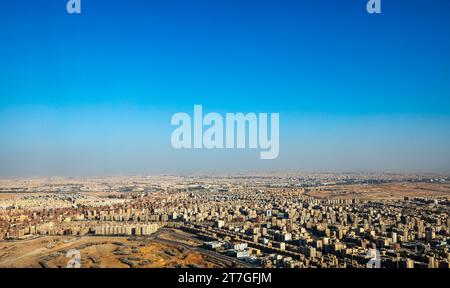 Aerial view of vast expanse of high rise apartments that crowd the city ...
