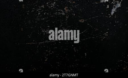 scratched black wall texture, black grunge background. Stock Photo