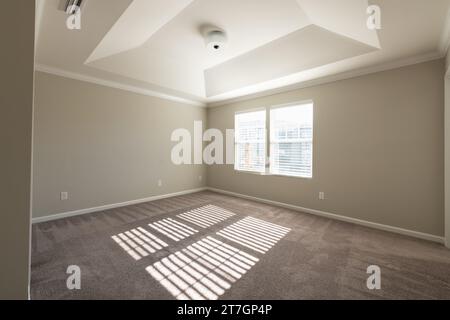 Unfurnished contemporary bedroom in a townhome. Investment, renting, home decorating, or real estate concept. Stock Photo