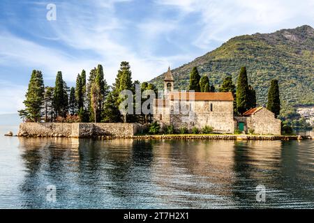The former seafaring centre of Perast, with the beautiful offshore island of Sveti Dorde, St. George, in the Bay of Kotor, Montenegro, Perast Stock Photo