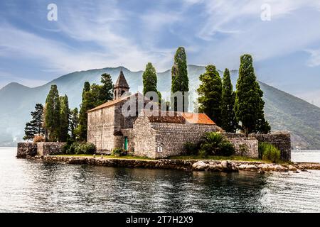 The former seafaring centre of Perast, with the beautiful offshore island of Sveti Dorde, St. George, in the Bay of Kotor, Montenegro, Perast Stock Photo