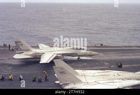 Navy 1981-82 WESTPAC  flight ops aboard the USS Constellation aircraft carrier CV-64 with F-14 Tomcats VF-24 and VF-211, A-7 Corsairs VA-146 and VA-147, A-6 Intruders VA-165, S-3 Vikings VS-38, E-2 Hawkeyes VAW-112, EA-6 Prowlers VAQ-134, and H-3 Seakings HS-8. In air photos feature at sea refueling, formation fly bys, submarines, rescue practice, flight deck operations, catapult launches, landing traps, and at sea operations. These photos where taken from the perspective from difficult to access locations while underway during flight ops either on deck or in flight Stock Photo