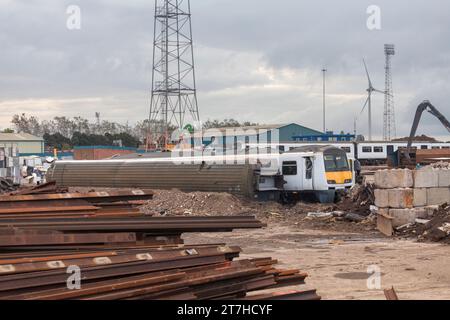 Scrap class 321 electric multiple unit trains waiting to be broken up and recycled at SIMS metals, Newport docks, South Wales, UK Stock Photo