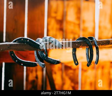 A closeup of horseshoes on a pole in Holloko village in northern Hungary, in Nograd County Stock Photo