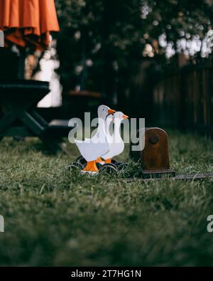 The wooden goose on green grass in Holloko village in northern Hungary, in Nograd County Stock Photo