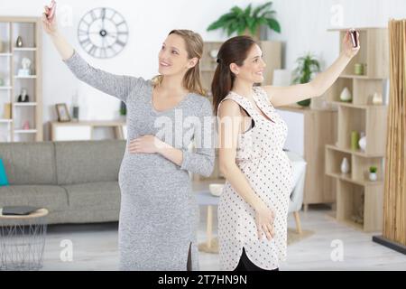 two pregant women taking a selfie Stock Photo