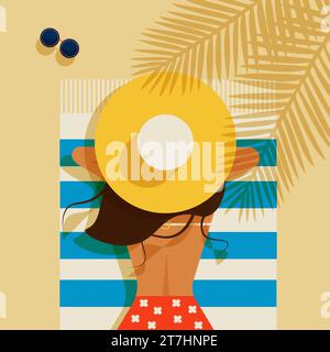 A young woman wearing a straw hat lies on a striped beach towel. Stock Photo
