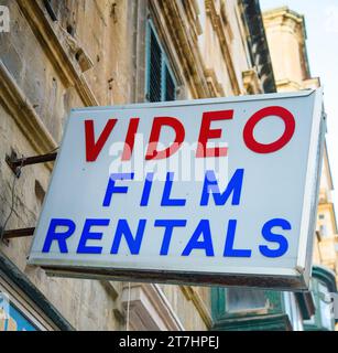 Sign outside a video rental shop, all of which have closed down following Internet streaming sites like Netflix, Hulu, Disney+, Amazon Prime, Youtube Stock Photo