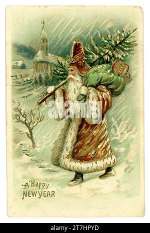 Original postcard of early style Father Christmas wearing a brown coat, carrying a green sack, carrying toys and a tree in the snow, happy new year is greeting. Pub by the Novelty postcard Co. Liverpool. Circa 1905 Stock Photo