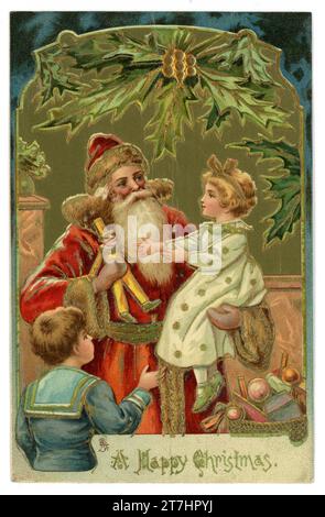 Original charming Edwardian era embossed Christmas card of santa with children receiving presents sitting on his knee. Tuck's Christmas series 1004. Victorian Christmas card cards.  Circa 1905, U.K. Stock Photo