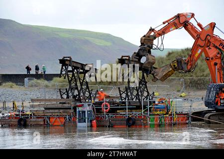 Old sections of Barmouth rail bridge cut up on Barmouth beach after being removed from as replacement sections are installed, Sept  2023 Stock Photo