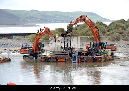 Old sections of Barmouth rail bridge cut up on Barmouth beach after being removed from as replacement sections are installed, Sept  2023 Stock Photo