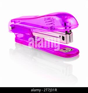The pink glass stapler isolated on white background Stock Photo