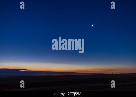 This is Venus (brightest) and dim Mecury (low and to the left in the twilight) in the dawn sky as morning stars.  Venus was just 3 days past its point Stock Photo