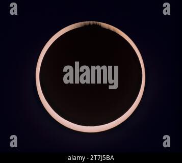 This is a composite of the October 14, 2023 annular solar eclipse at second contact. It illustrates the irregular edge of the Moon breaking up the rim Stock Photo