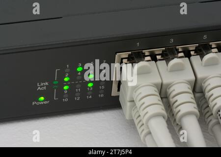 Network switch with RJ45 network cables Stock Photo