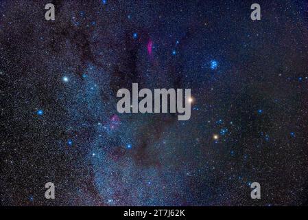 Mars, the bright orange object right of centre, is here amid the stars and constellations of the winter Milky Way in January 2023. Mars is in Taurus, Stock Photo