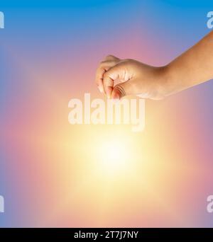 Child hand hanging something blank isolated on a white background Stock Photo