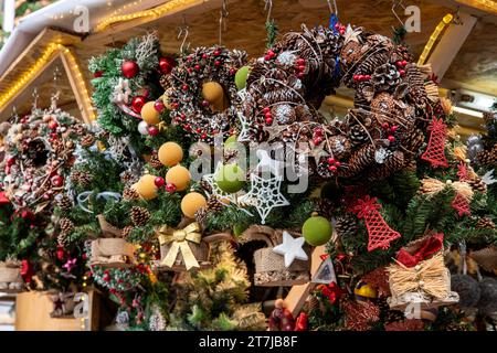 Santa Llucia Market's enchanting corner: A stall brimming with exquisite Christmas wreaths, adding festive charm to Barcelona's holiday spirit Stock Photo